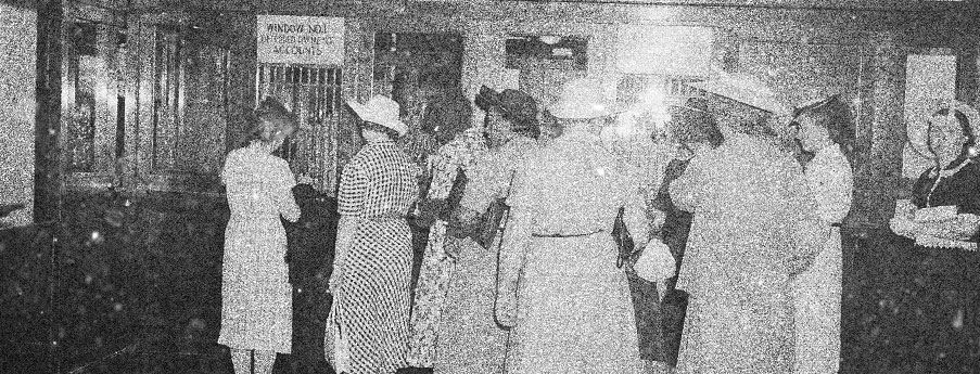 Women standing in a line at the Payment Center inside Lovat City Hall