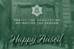 A Happy Auseil greeting showing several officers standing at attention in front of a police station, text reads: protecting and serving no matter the season