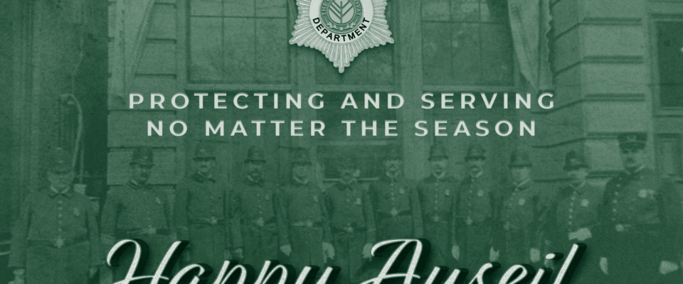 A Happy Auseil greeting showing several officers standing at attention in front of a police station, text reads: protecting and serving no matter the season