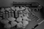 A revolver and some drug paraphernalia