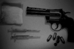 A revolver and some drug paraphernalia