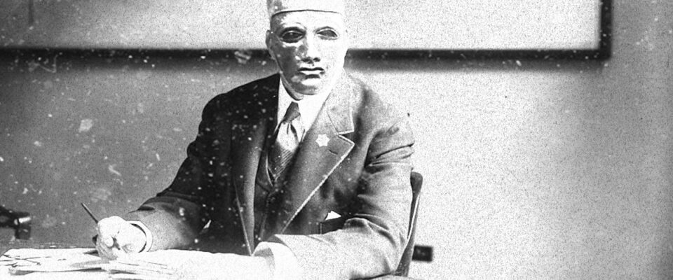 Lovat Chief of Police, Dumot Palladio at his desk.