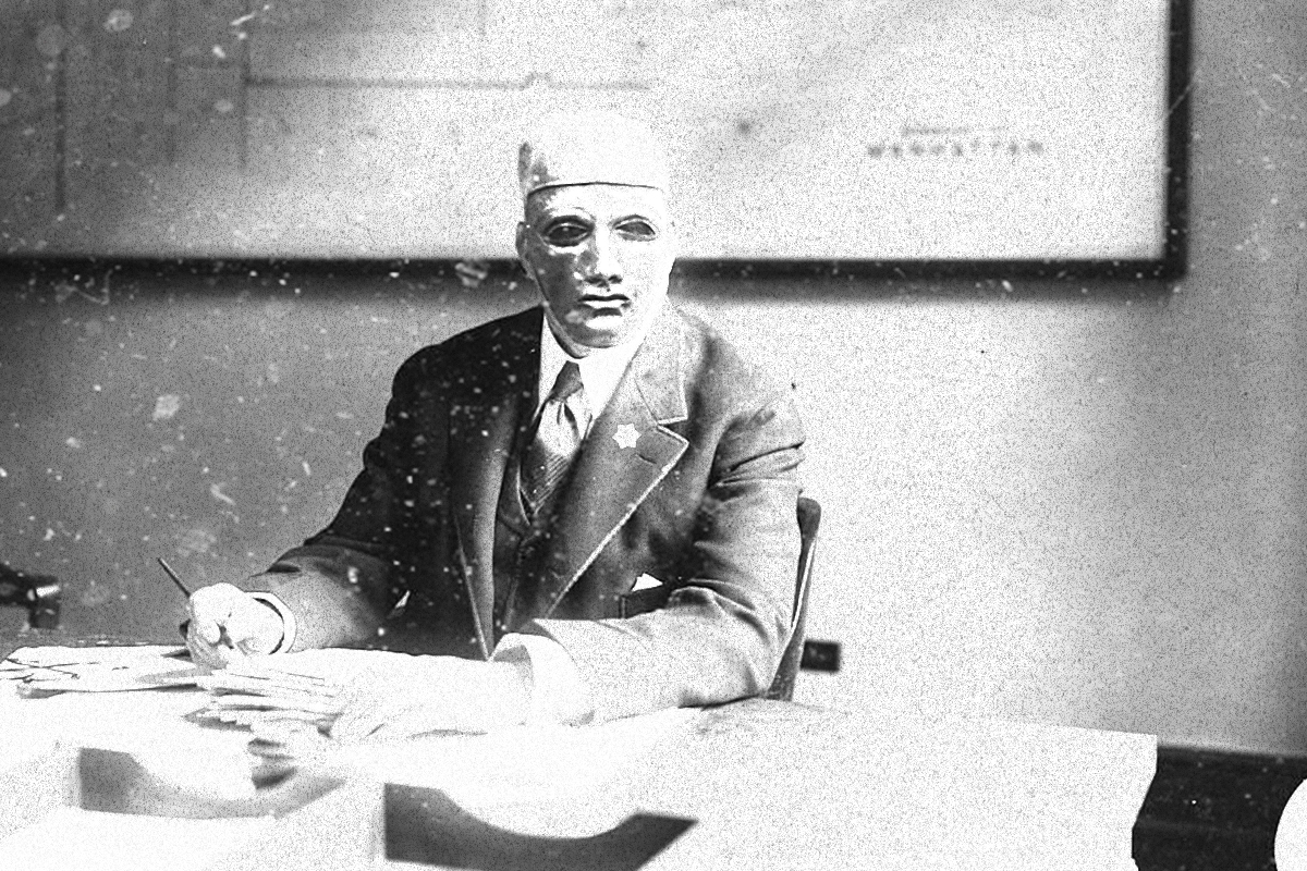 Lovat Chief of Police, Dumot Palladio at his desk.