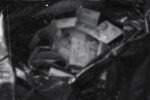 A black plastic trash bag filled with counterfeit lira.