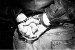 a human man handcuffed