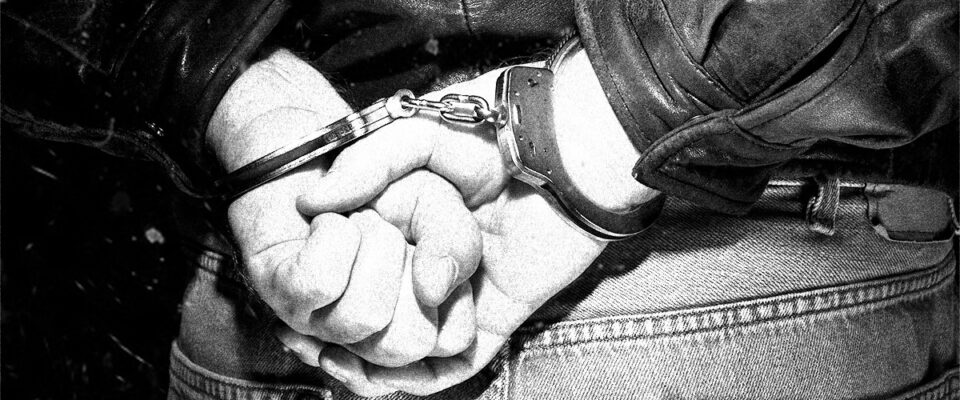 a human man handcuffed