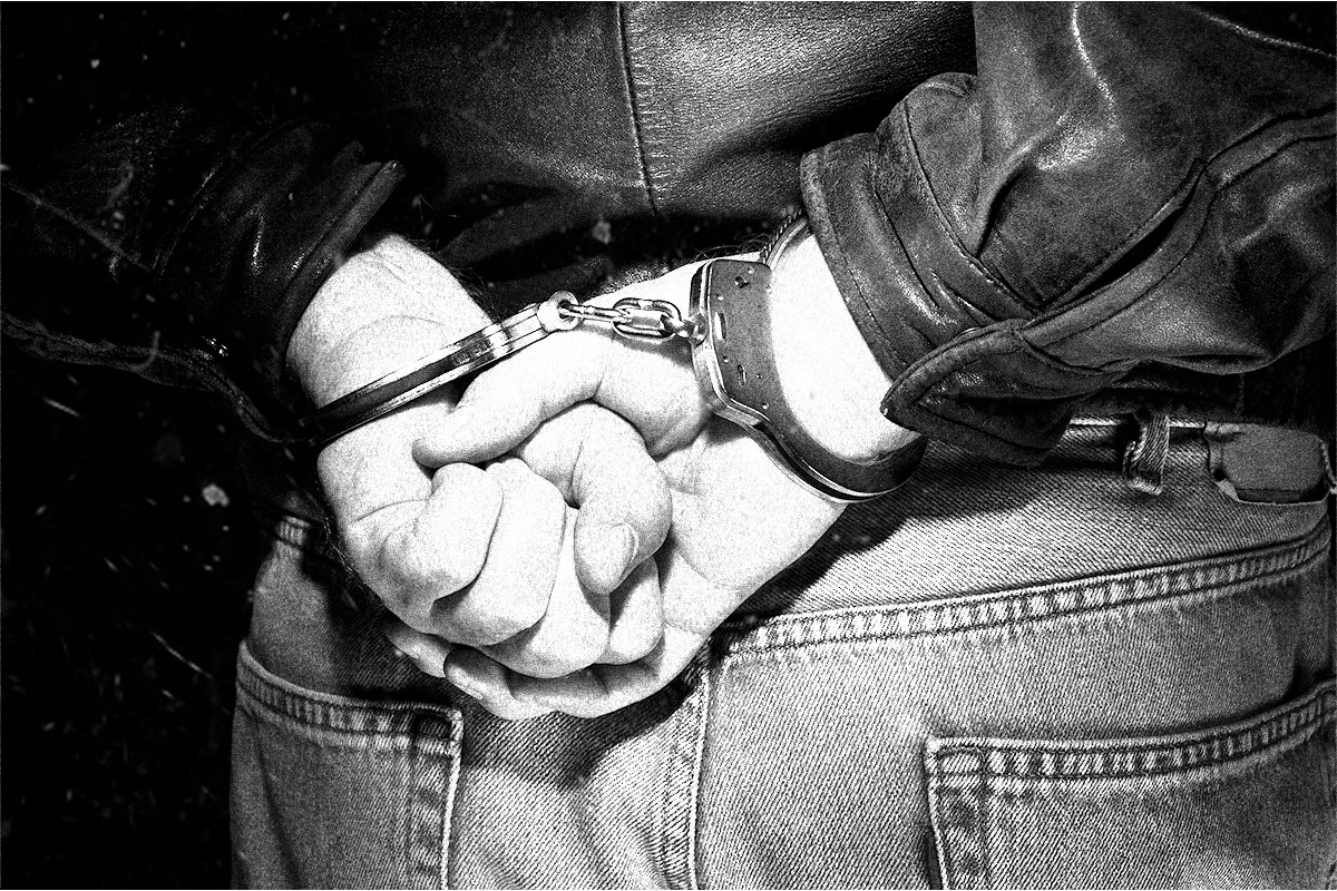 a human man handcuffed